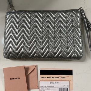 Miu Miu chrome wristlet